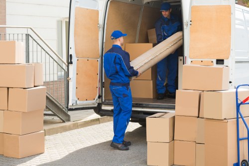 Removal team planning a move on a Chiswick residential street