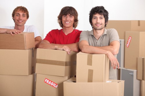 Local furniture pickup crew loading office furniture in Chiswick