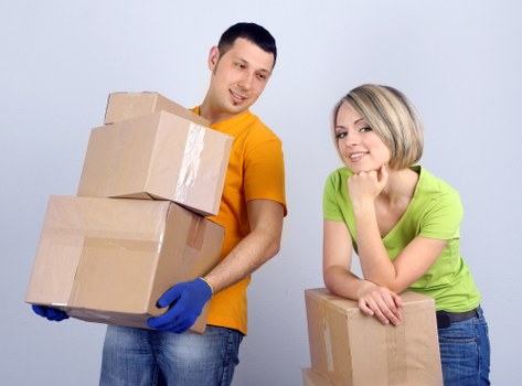 Removal boxes, tape, and wrapping materials prepared for a move in Chiswick
