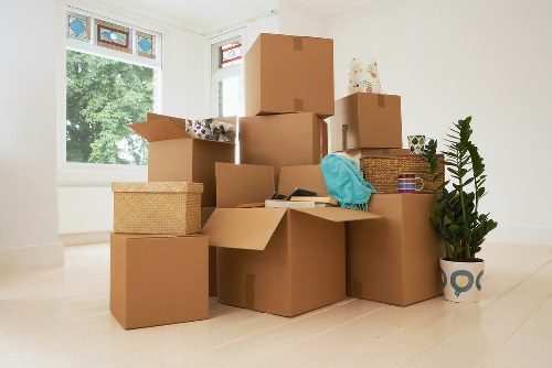 Staff communicating safety checks before lifting furniture