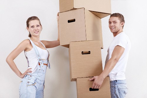 Careful loading of household items for a flat relocation in West London