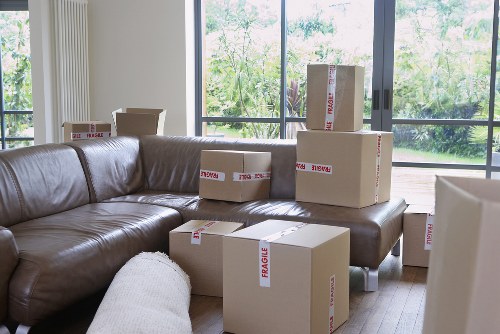 Furniture and boxes being loaded for a Chiswick move using a suitable removal truck