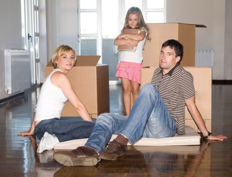Local packing team preparing boxes in a Chiswick property with narrow access