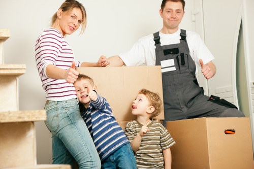 Removal team managing furniture and boxes in Chiswick